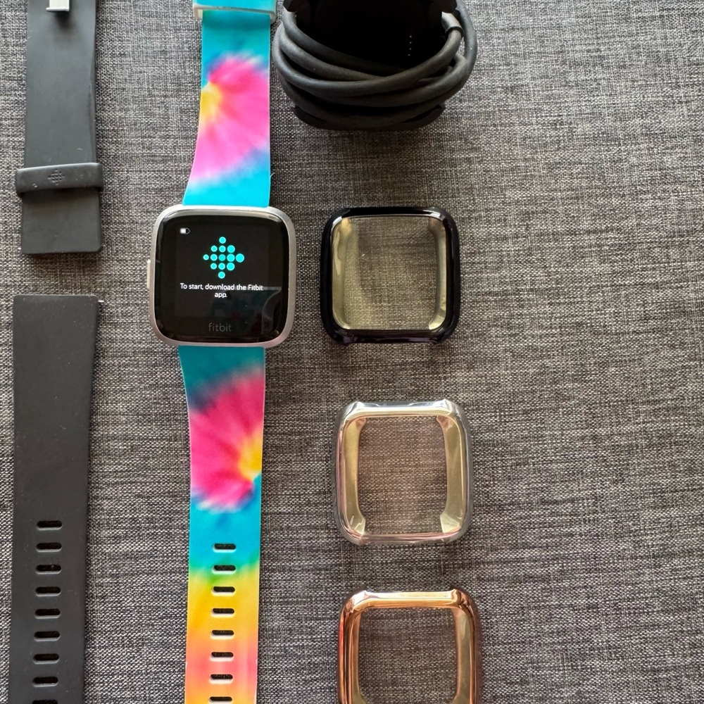 Fitbit versa lite Smartwatch with Tie-Dye and Gray Bands, charger cord